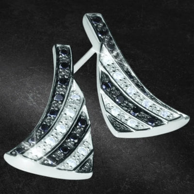 Sterling silver Chess Earrings featuring a curved triangular design with alternating rows of black and clear stones, crafted for women’s elegant jewelry collections.