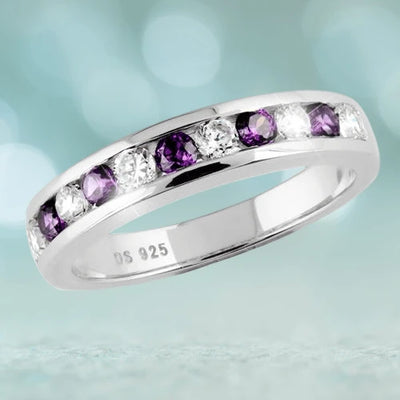 Sterling silver Manhattan Stacker A ring for female featuring alternating round purple and clear gemstones in a sleek, polished band design.