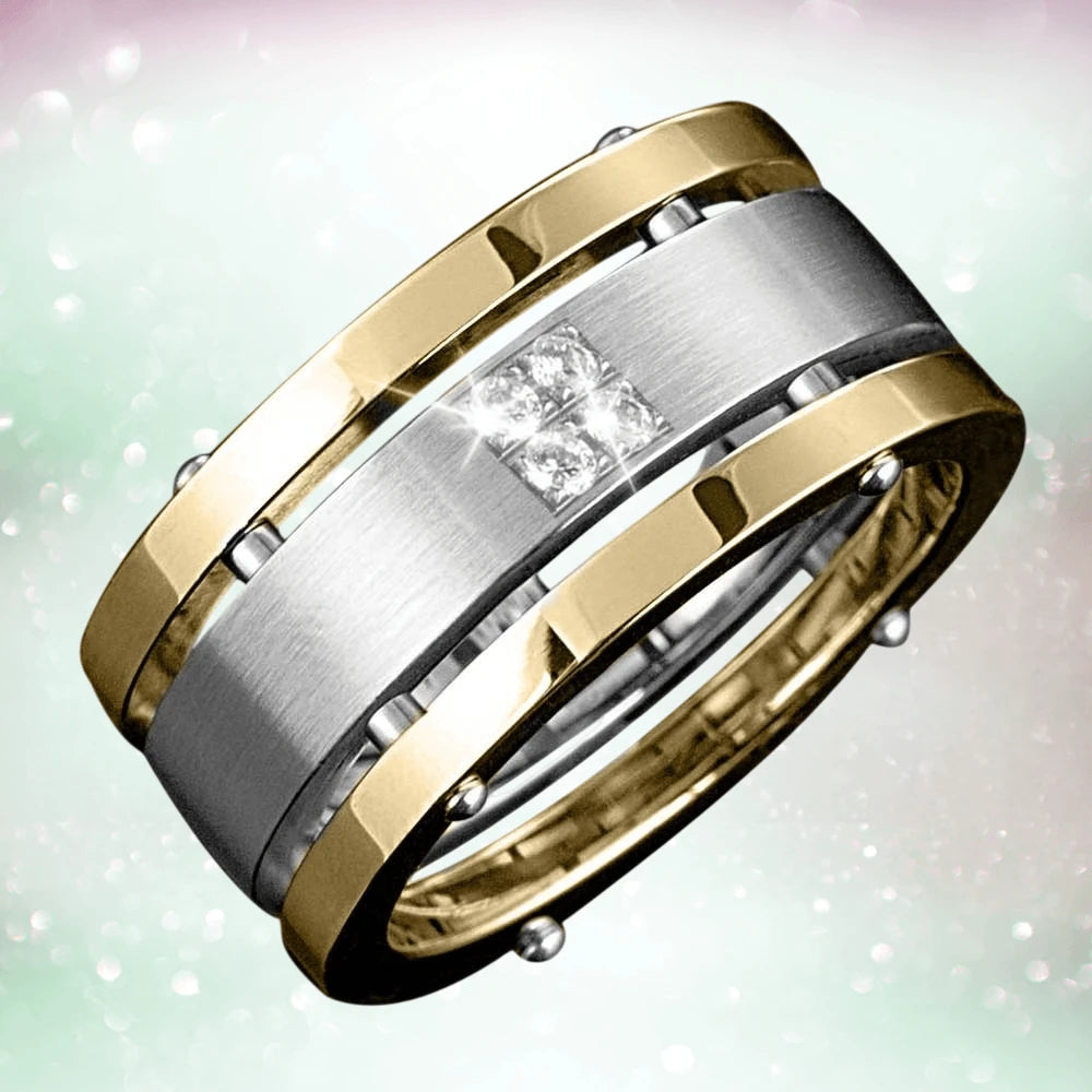 Quattro Ring featuring a two-tone stainless steel design with a brushed silver center and polished gold edges, accented by four small sparkling stones for a masculine jewelry piece.