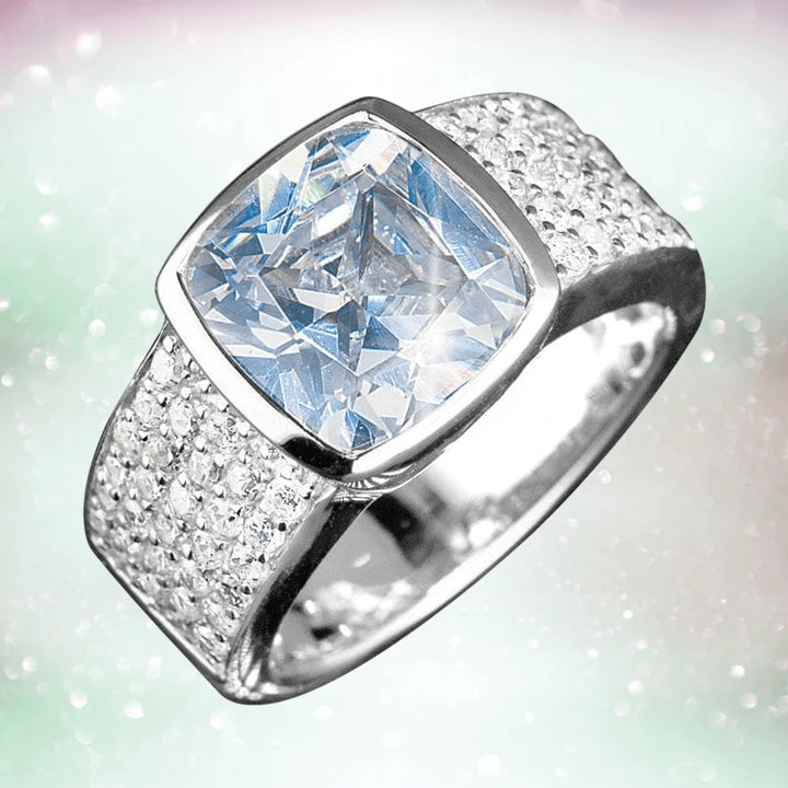 Embassy Silver Ring (White) featuring a large cushion-cut clear gemstone set in sterling silver with rhodium plating, designed for men’s jewelry collections.