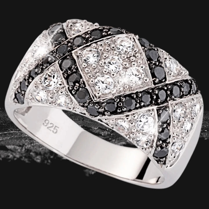 Close-up of a Lattice Ring crafted in sterling silver, featuring an intricate design with sparkling black and white stones, designed for women’s jewelry collections.