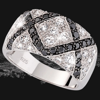 Close-up of a Lattice Ring crafted in sterling silver, featuring an intricate design with sparkling black and white stones, designed for women’s jewelry collections.