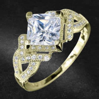 Palermo Gold Ring featuring a sterling silver band with gold plating, showcasing a large square clear gemstone centerpiece surrounded by intricately set smaller stones for a feminine jewelry piece.