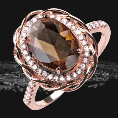 Versa Mocha Ring featuring a large oval mocha gemstone set in sterling silver with rose gold plating, accented by sparkling clear stones around the center and along the band.