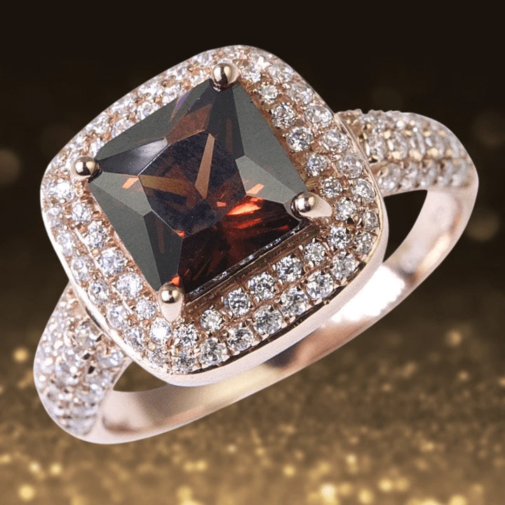 Pave Riviera Ring featuring a sterling silver band with rose gold plating, adorned with a large dark central gemstone surrounded by sparkling pave-set crystals, elegant jewelry for female wear.