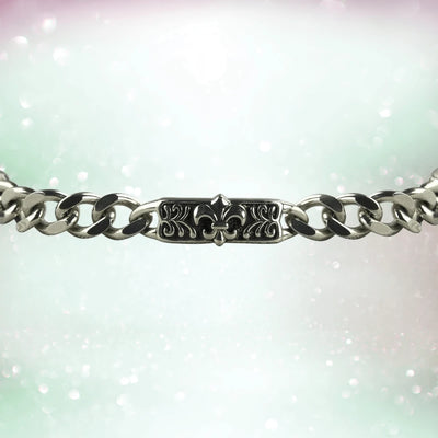 Fiorino Steel Bracelet featuring a stainless steel chain with a detailed central plate engraved with a fleur-de-lis design, elegant men's jewelry accessory.