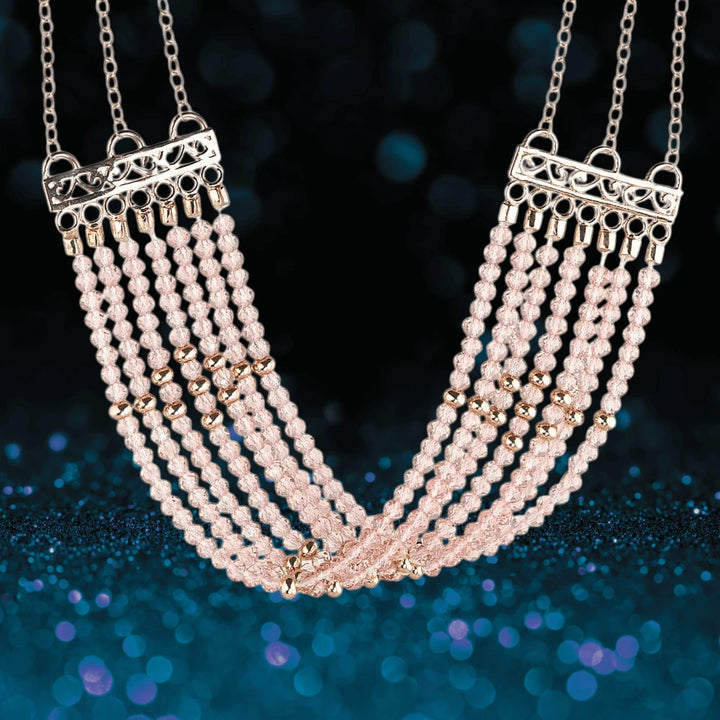 Rosa Cascade Necklace featuring multiple strands of rose gold plated gems with intricate metallic connectors, designed for a sophisticated female jewelry collection.