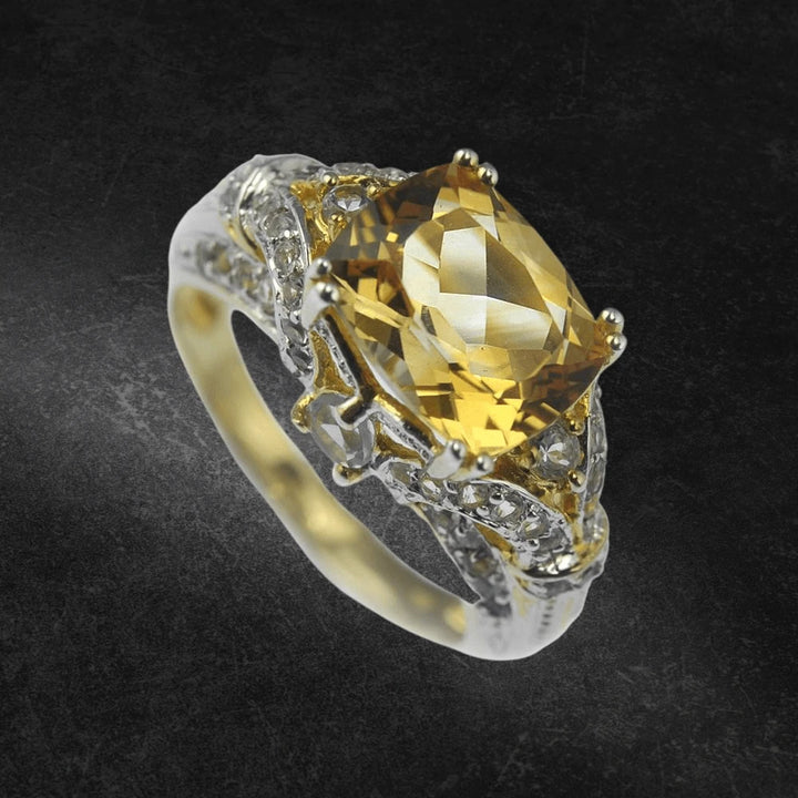 Antoinette Citrine Ring featuring a large cushion-cut citrine gemstone set in a two-tone sterling silver band with intricate detailing, designed for women’s jewelry.