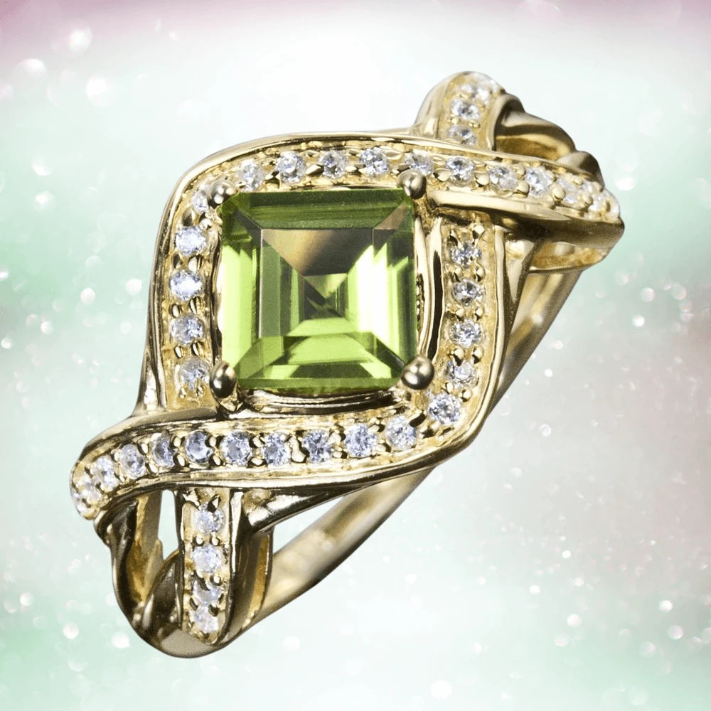 Palermo Peridot Ring featuring a square peridot gemstone set in sterling silver with gold plating and accented with sparkling small clear stones, designed for women.
