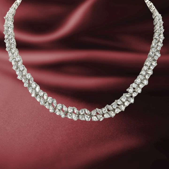 Versailles Necklace featuring sparkling white base metal stones with gold plating, designed elegantly for female jewelry enthusiasts.