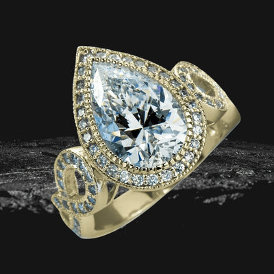 Marie Anna Teardrop Gold Ring featuring a large teardrop-shaped crystal center stone surrounded by smaller crystals on a sterling silver band with gold plating designed for women.