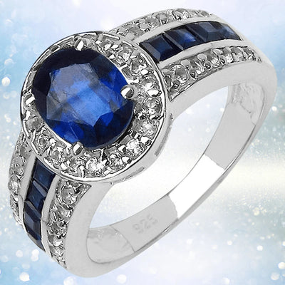 Kyanite Ring crafted in sterling silver with rhodium plating, featuring a deep blue oval kyanite center stone surrounded by sparkling accents, designed for women.