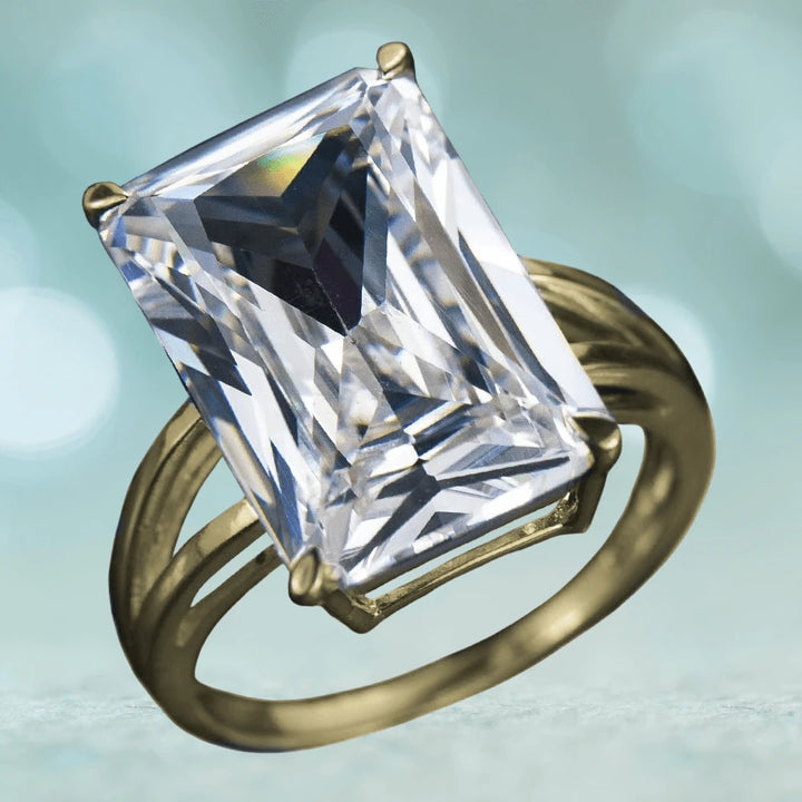 Trillionaire Gold Ring featuring a large rectangular clear gemstone set in a gold-plated sterling silver band designed for women, showcasing elegant luxury jewelry style.