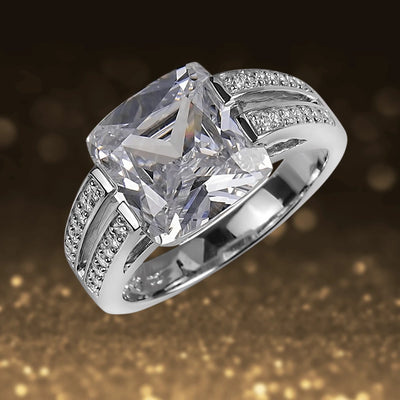 Minima Ring featuring a large square-cut clear gemstone set in sterling silver with rhodium plating, designed for women, with intricate smaller stones embedded along the band.