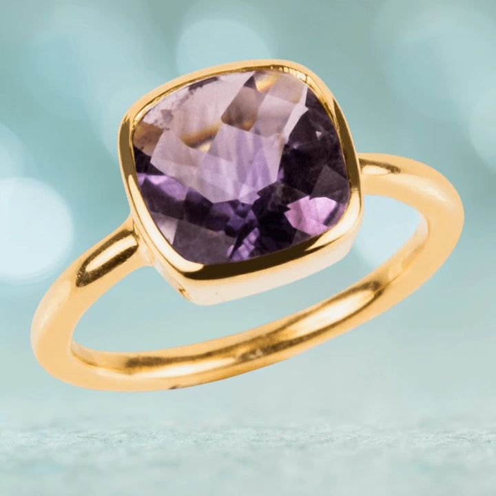 Dream Gems Ring Amethyst Purple featuring a sterling silver band with gold plating and a cushion-cut purple amethyst stone, designed for women’s jewelry collections.