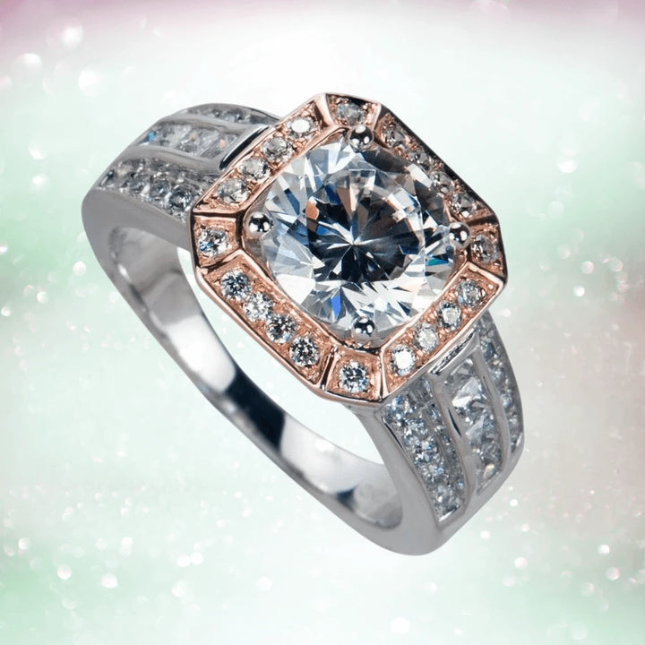 Piazza Ring featuring a sterling silver two-tone design with a large central gemstone surrounded by smaller sparkling stones, elegant female jewelry ring.
