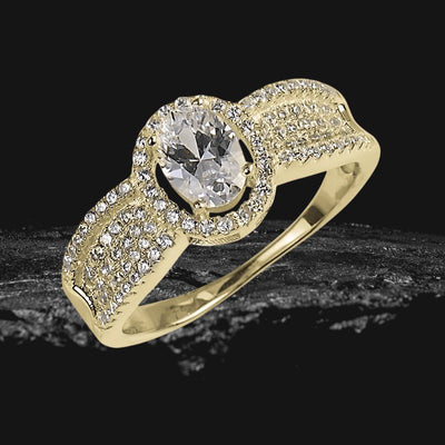 Carolina Ring featuring a sterling silver base with gold plating, adorned with a large central clear gemstone and multiple smaller sparkling stones, designed for females.