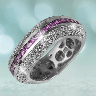 Palacio Silver Ring in sterling silver with rhodium plating, featuring sparkling clear stones and a row of vibrant purple gemstones, designed for women’s jewelry collections.