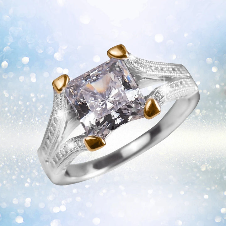 Princessa Ring featuring a two-tone sterling silver band with a square-cut clear stone, elegantly designed for women’s jewelry collections.