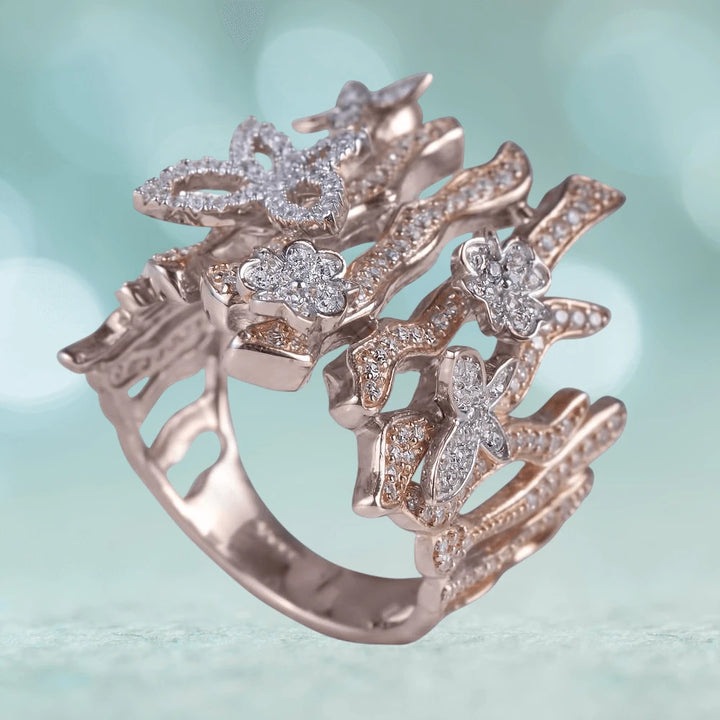 Woodland Butterfly Ring crafted in sterling silver with rose gold plating, featuring intricate butterfly and floral designs adorned with sparkling accents for women’s jewelry.