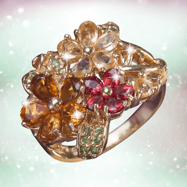 Golden Corsage Ring crafted in sterling silver with gold plating, featuring intricate floral design with amber, red, and light-colored gemstones, designed for women’s jewelry.