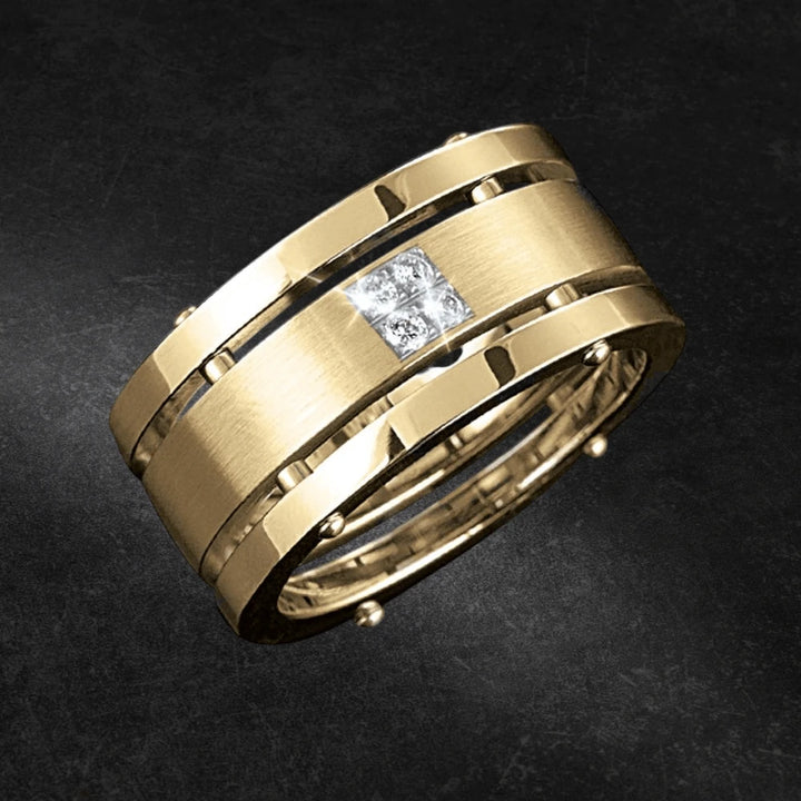 Quattro Ring Gold featuring a stainless steel band with gold plating and embedded square-shaped clear gemstones, designed for male jewelry collection.