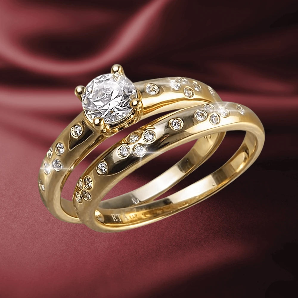 Stardust Ring featuring a sparkling central stone and multiple smaller stones set in gold-plated sterling silver, designed for women’s jewelry collections.