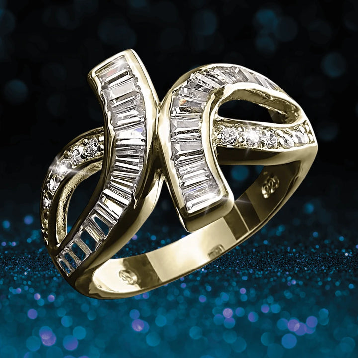 Baguette Twist Ring Gold crafted from sterling silver with gold plating, featuring an elegant design accented by rectangular and round clear stones, perfect for female jewelry collectors.