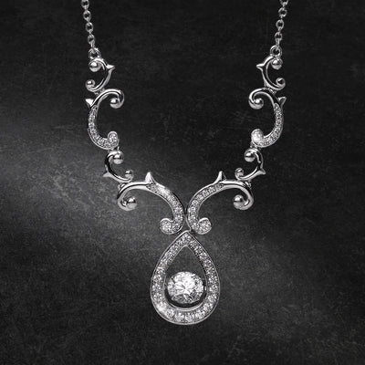 Rococo Dancing Necklace in sterling silver with rhodium plating, featuring intricate scrollwork and a central sparkling pendant, designed for females seeking elegant jewelry.