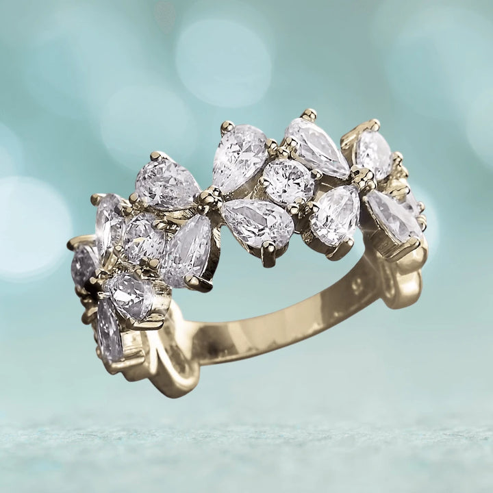 Petal Flower Ring crafted in sterling silver with gold plating, featuring an elegant arrangement of clear gemstones resembling flower petals, designed for women’s jewelry.