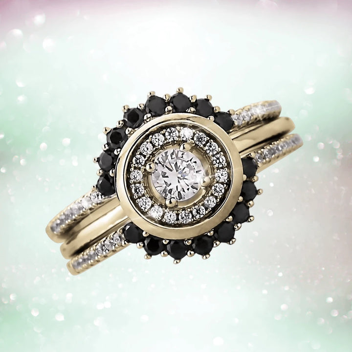 Close-up of a Trio Halo Ring featuring a sterling silver base with gold plating, adorned with sparkling white and black gemstones, designed for women’s jewelry.