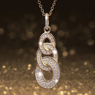 Trianon Pendant featuring intertwined oval links adorned with sparkling stones, crafted in sterling silver with gold plating, designed for women’s jewelry collections.