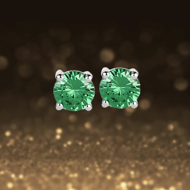 Brilliant Birthstones Earrings May featuring round green stones set in sterling silver with rhodium plating, designed for women’s elegant jewelry collections.