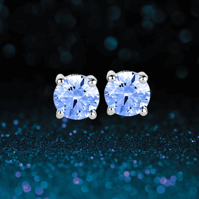 Brilliant Birthstones Earrings December featuring sparkling blue gemstones set in sterling silver with rhodium plating, designed elegantly for women’s jewelry collections.