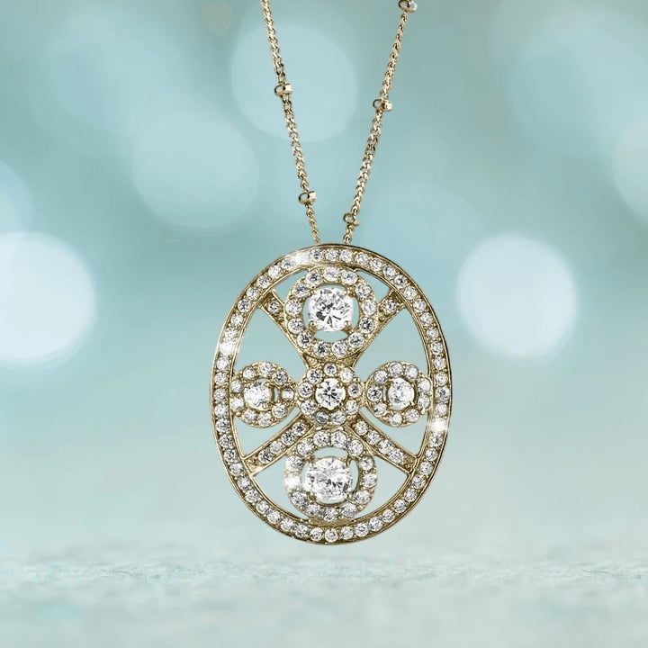 Decora Ladies' Pendant crafted in sterling silver with gold plating, featuring an oval design encrusted with sparkling clear stones on a delicate gold chain necklace.