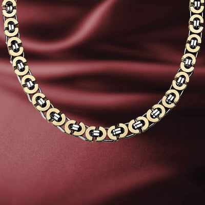 Emperor Flat Byzantine Necklace designed for men featuring interlocking gold and silver links, elegantly displayed on a rich burgundy fabric background.
