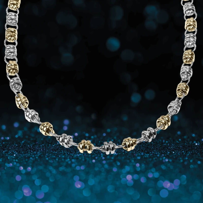 Quintus Steel Necklace featuring alternating silver and gold-tone links designed for male jewelry, creating a bold and stylish statement piece.