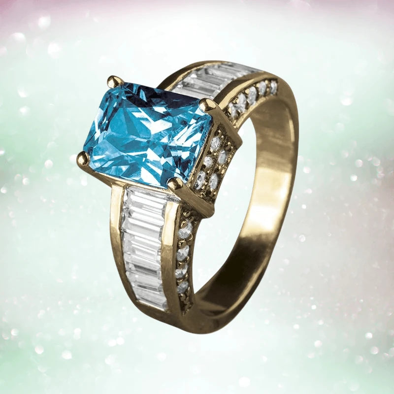 Sterling silver Sonora Dress Ring featuring a large rectangular blue gemstone centerpiece with baguette and small round accent stones on the band, designed for women.