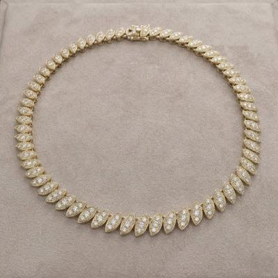 Captivating Leaf Necklace for female featuring gold plating with sparkling leaf-shaped segments forming an elegant jewelry necklace.