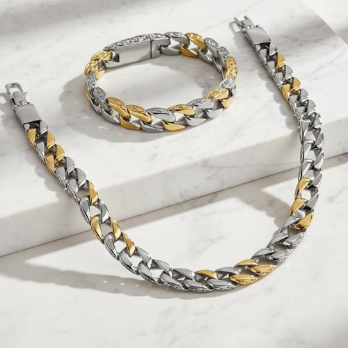 Two-tone silver and gold chain necklace and bracelet on a light . Curb Vine Men&