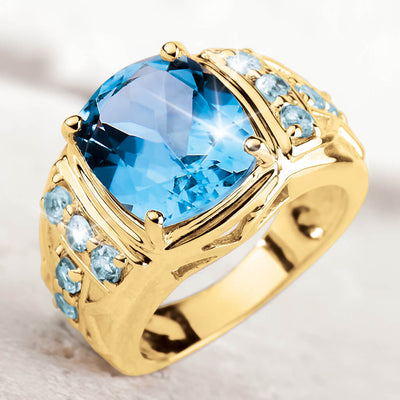 Mediterranean Blue Topaz Ring featuring a large blue topaz center stone surrounded by smaller blue topaz accents, set in sterling silver with gold plating for a luxurious men's jewelry piece.