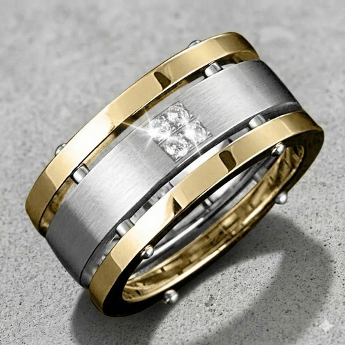Two-tone gold and silver ring with a diamond on a gray surface