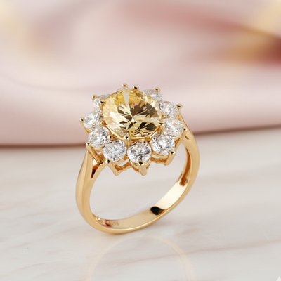 Gold ring with a large yellow gemstone and smaller clear stones on a light background