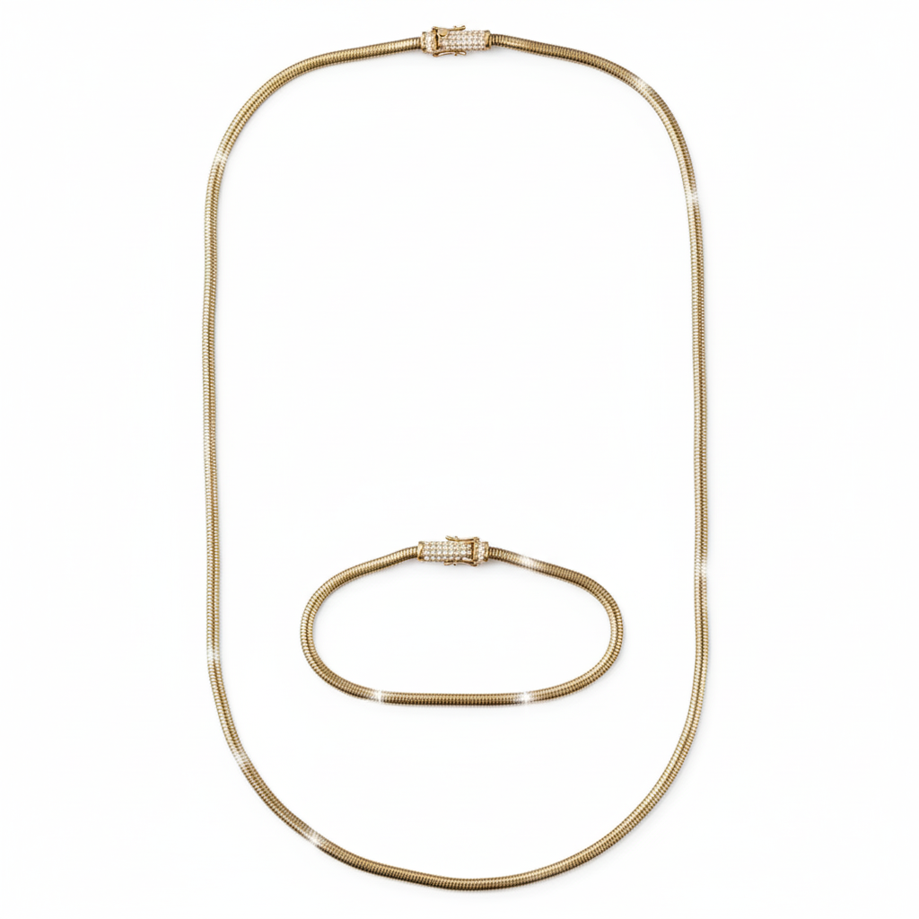 Gold necklace and bracelet set on a white background