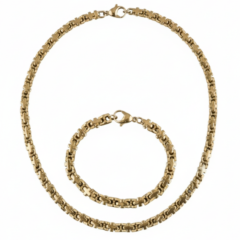 Gold chain necklace and bracelet set on a white background
