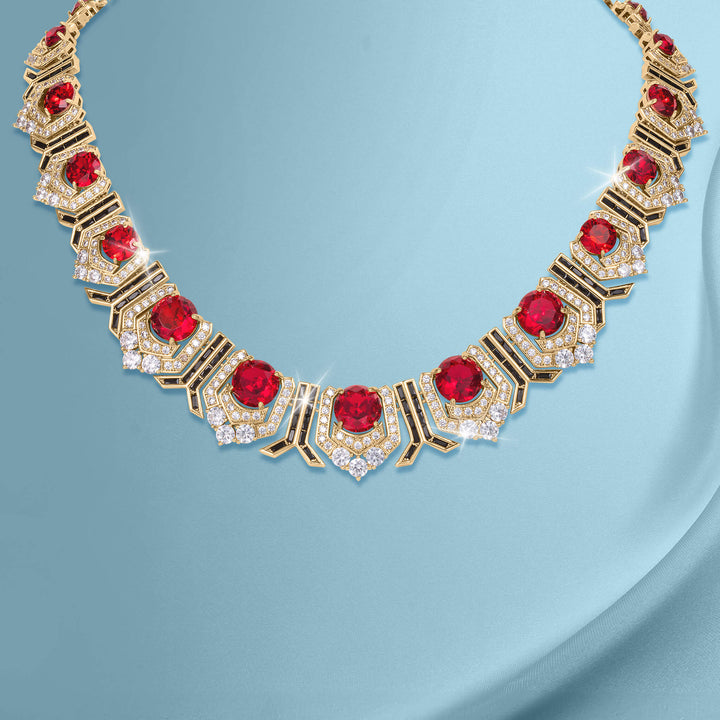 Elegant gold necklace from the Scarlet Heirloom Collection featuring vibrant red gemstones and sparkling crystals, available Up To 75% Off Retail.