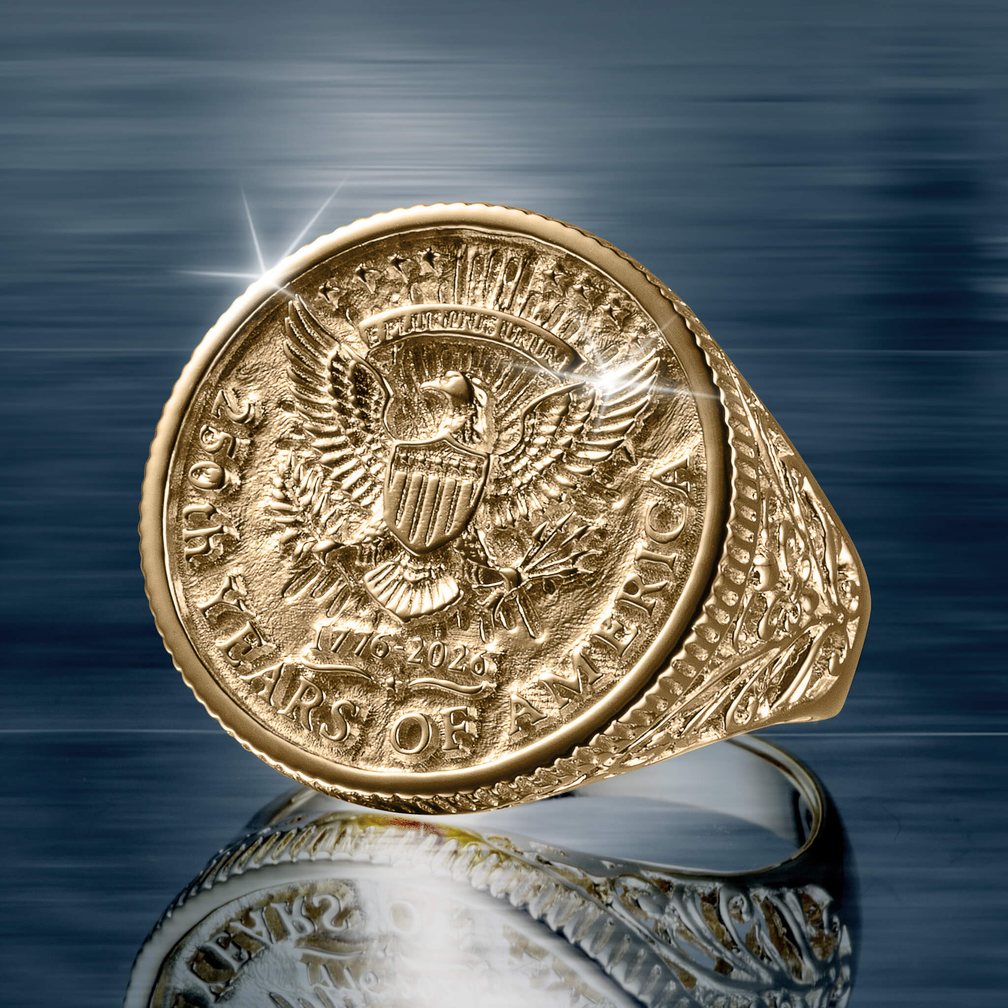 Close-up of a detailed gold ring from the American Glory Collection featuring an embossed eagle emblem and 