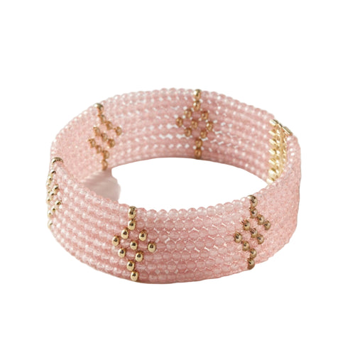 Pink beaded bracelet with gold accents on a white background. Rosa Cascade Bracelet