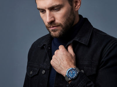 Ultima Men's Watch with a blue chronograph dial and stainless steel bracelet worn by a man in a black jacket Up To 75% Off Retail
