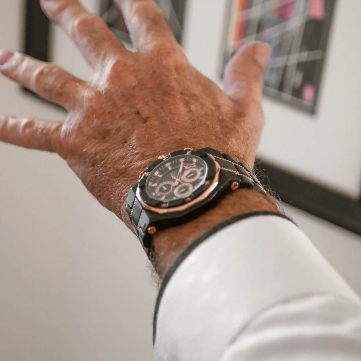 Phantom Black Men's Watch with a stainless steel two-tone design and black dial, stylishly worn on the wrist, showcasing luxury craftsmanship for men’s watches and jewelry.